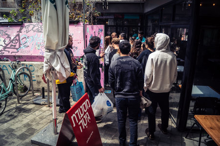 Tel Aviv, Israel, March 22, 2026 People rushing into a public bomb shelter or miklat and waiting...
