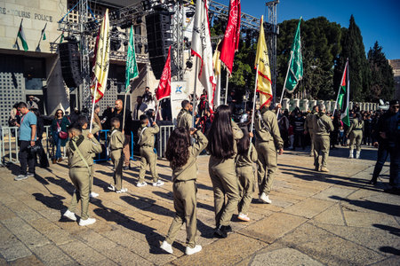 Bethlehem, West Bank, December 24, 2025 Young Palestinian scouts march in formation in the streets...