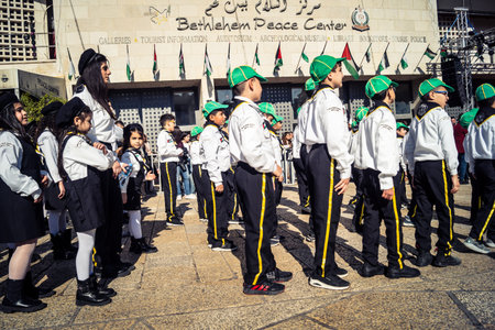 Bethlehem, West Bank, December 24, 2025 Young Palestinian scouts march in formation in the streets of Bethlehem during the annual Christmas parade. It is a central part of the cultural celebrations.のeditorial素材