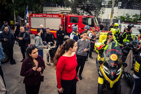 Tel Aviv, Ramat Gan, Israel, March 18, 2026 Emergency services including firefighters, paramedics,...