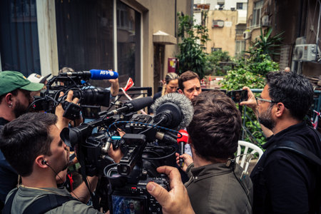 Tel Aviv, Ramat Gan, Israel, March 18, 2026 International news correspondents and camera crews from global agencies including AFP, AP and Reuters present at the scene at the exact moment of the Iranian missile attack in the Ramat Gan district of Tel aviv.のeditorial素材