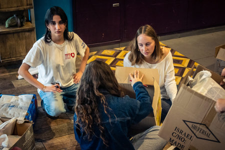 Tel Aviv, Israel,Â  March 5, 2026 Groups of young Israeli volunteers assemble and pack...