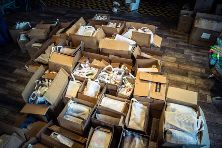 Tel Aviv, Israel,Â  March 5, 2026 Groups of young Israeli volunteers assemble and pack humanitarian aid boxes at a local distribution center. The supplies, including food and items for children, are prepared for civilians and refugees displaced by the ongのeditorial素材