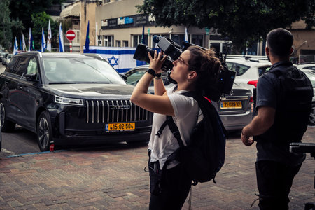 Tel Aviv, Ramat Gan, Israel, March 18, 2026 TVE Spanish public television crew present at the scene at the exact moment of the Iranian missile attack in the Ramat Gan district of Tel Aviv. The media team was very close to the impact site, witnessing the eのeditorial素材