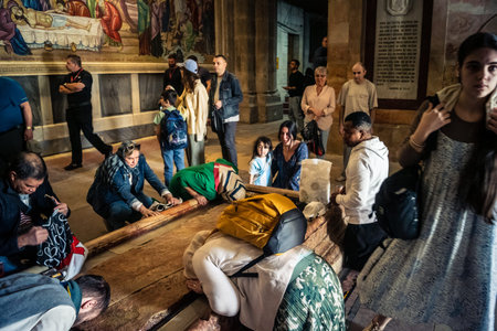 JERUSALEM, ISRAEL - FEBRUARY 16, 2026 Various global Christian denominations gathered in prayer in the Church of the Holy Sepulchre. Unity of faith, cultural diversity and unique religious fervor.のeditorial素材