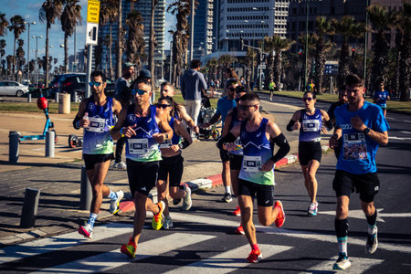 Tel Aviv, Israel, February 27 2026 Large crowd of runners competing in the streets during the annual marathon, thousands of participants joining the major sporting event, urban race documentation and editorial photography.のeditorial素材