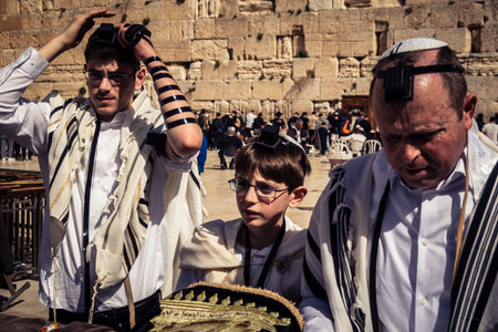 Jerusalem, Israel - February 18, 2026. Bar Mitzvah celebration at the Kotel. Religious rite of passage marking the transition to maturity at the holiest site in Judaism.のeditorial素材