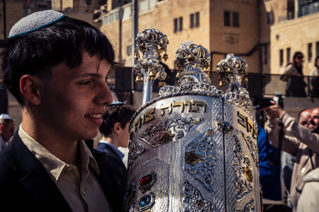 Jerusalem, Israel - February 18, 2026. Bar Mitzvah celebration at the Kotel. Religious rite of passage marking the transition to maturity at the holiest site in Judaism.のeditorial素材