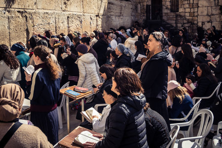 Jerusalem, Israel - February 18, 2026. Deep devotion in the Western Wall women's section. Solitary prayer and reflection, highlighting spiritual strength.のeditorial素材