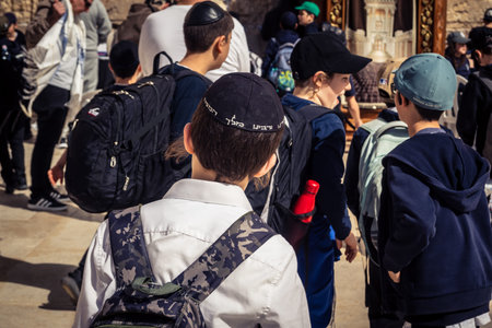 Jerusalem, Israel - February 18, 2026. Children standing at the Western Wall plaza, Jerusalem. Innocence of children against the solemnity of prayers and historic remains.のeditorial素材
