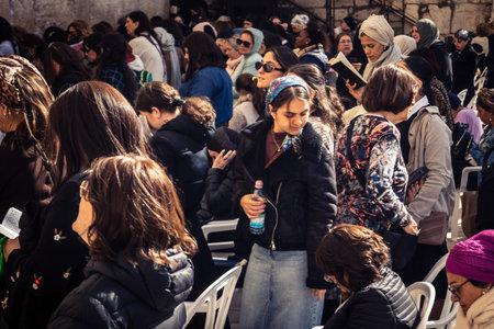 Jerusalem, Israel - February 18, 2026. Deep devotion in the Western Wall women's section. Solitary...