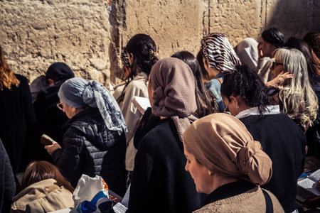 Jerusalem, Israel - February 18, 2026. Deep devotion in the Western Wall women's section. Solitary prayer and reflection, highlighting spiritual strength.のeditorial素材