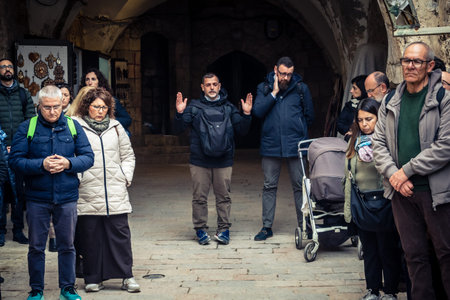 Jerusalem, Israel, 19 February 2026  Italian Christian pilgrims led by a priest conduct an official...