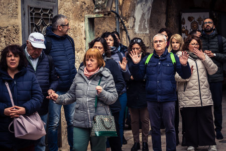 Jerusalem, Israel, 19 February 2026  Italian Christian pilgrims led by a priest conduct an official...