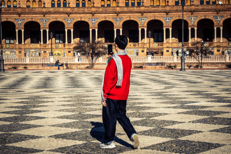 Seville, Spain, December 11, 2025 Tourists visiting the Plaza of Spain, a plaza in the Parque de...