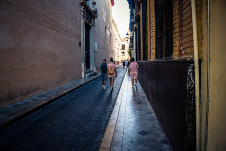Seville, Spain, September 21, 2025 Tourists visit the historic district of downtown Seville and walk...