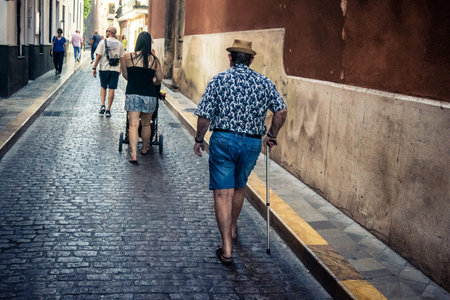 Seville, Spain, September 21, 2025 Tourists visit the historic district of downtown Seville and walk through the narrow, picturesque streets.のeditorial素材