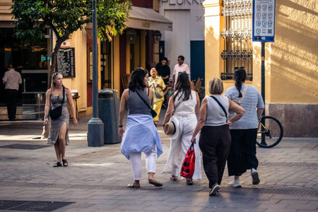 Seville, Spain, September 21, 2025 Tourists visit the historic district of downtown Seville and walk through the narrow, picturesque streets.のeditorial素材