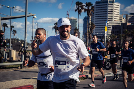 Tel Aviv, Israel, February 27, 2026 A participant makes direct eye contact and waves at the camera,...