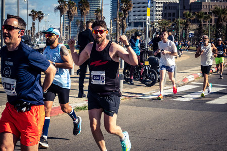 Tel Aviv, Israel, February 27, 2026 A participant makes direct eye contact and waves at the camera,...