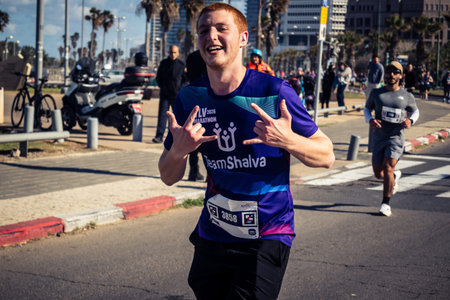Tel Aviv, Israel, February 27, 2026 A participant makes direct eye contact and waves at the camera,...