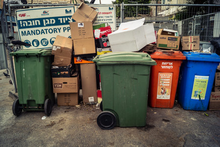 Tel Aviv, Israel, March 14, 2026 Rows of public garbage bins stand abandoned on the sidewalks as a...