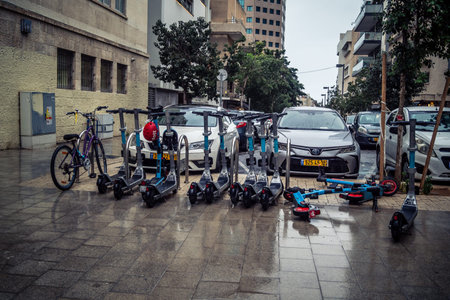 Tel Aviv, Israel, March 21, 2026 Street view of Tel Aviv under the rain with light reflections on...