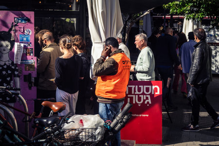 Tel Aviv, Israel, March 22, 2026 People rushing into a public bomb shelter or miklat and waiting...