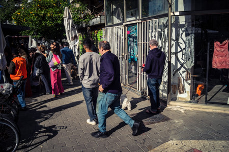 Tel Aviv, Israel, March 22, 2026 People rushing into a public bomb shelter or miklat and waiting...