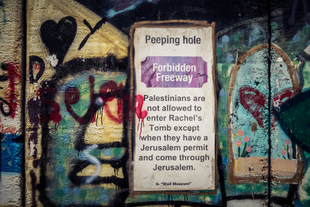 Bethlehem, West Bank, Palestine, March 23, 2026 Colorful and provocative political graffiti, murals,...