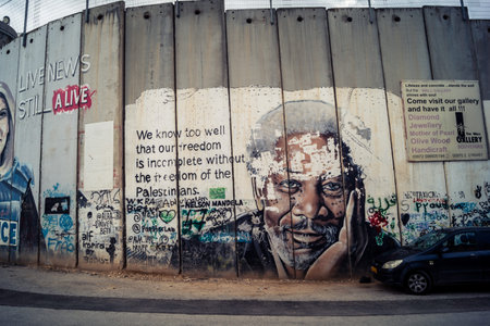 Bethlehem, West Bank, Palestine, March 23, 2026 Colorful and provocative political graffiti, murals,...