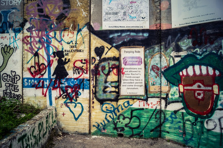 Bethlehem, West Bank, Palestine, March 23, 2026 Colorful and provocative political graffiti, murals,...