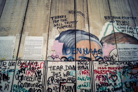 Bethlehem, West Bank, Palestine, March 23, 2026 Colorful and provocative political graffiti, murals,...