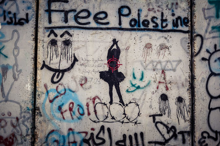 Bethlehem, West Bank, Palestine, March 23, 2026 Colorful and provocative political graffiti, murals,...