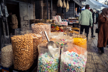 Hebron, West Bank, Palestine, March 25, 2026 Inside a traditional and bustling Palestinian grocery store specialized in bulk spices, dried fruits, and nuts in the heart of the historic old city of Hebron. The market stall is a sensory oasis, displaying doのeditorial素材