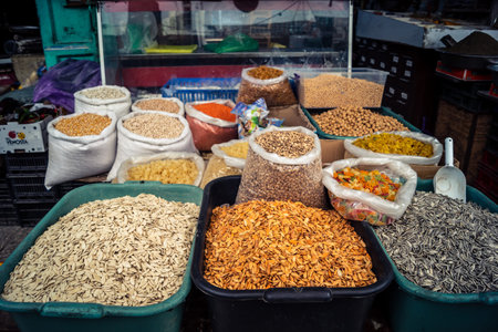 Hebron, West Bank, Palestine, March 25, 2026 Inside a traditional and bustling Palestinian grocery store specialized in bulk spices, dried fruits, and nuts in the heart of the historic old city of Hebron. The market stall is a sensory oasis, displaying doのeditorial素材