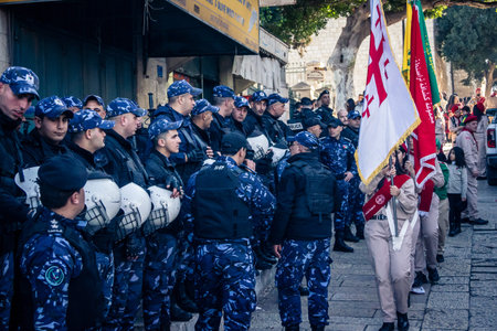 Bethlehem, West Bank, December 24, 2025 Palestinian police officers stand guard outside the main...