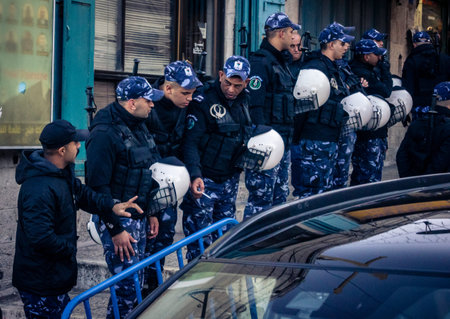 Bethlehem, West Bank, December 24, 2025 Palestinian police officers stand guard outside the main police headquarters in Bethlehem during the Christmas celebrations.のeditorial素材