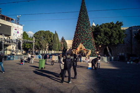 Bethlehem, West Bank, December 23, 2025 Tourists and pilgrims walking in Manger square, reflecting a moment of global unity and faith.のeditorial素材