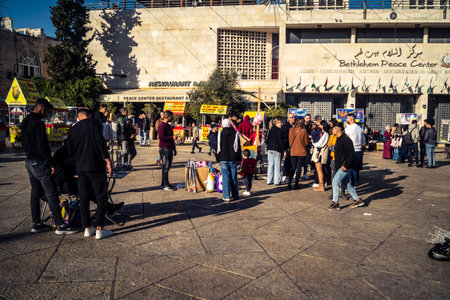 Bethlehem, West Bank, December 25, 2025 Tourists and locals gather in Manger Square, in front of the...