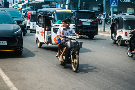 Sihanoukville, Cambodia, February 3, 2025 Traffic in the streets of Sihanoukville, a coastal city in Cambodia. Renowned for its rich cultural heritage, bustling market and vibrant street life.のeditorial素材