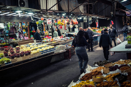 Tel Aviv, Israel, March 15, 2026 General view of the vibrant Carmel market showing the colorful displays of fresh produce, spices, and the energetic atmosphere of vendors and shoppers in the city's most famous open-air bazaar.のeditorial素材