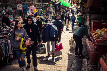 Tel Aviv, Israel, March 15, 2026 General view of the vibrant Carmel market showing the colorful displays of fresh produce, spices, and the energetic atmosphere of vendors and shoppers in the city's most famous open-air bazaar.のeditorial素材