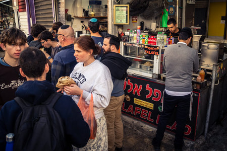 Tel Aviv, Israel, January 5, 2026 Daily life and morning bustle at the Carmel Market (Shuk HaCarmel), largest open-air marketplace. Local vendors and authentic street scenes in the heart of Tel Aviv.のeditorial素材