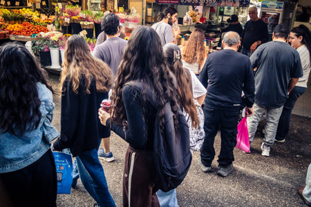 Tel Aviv, Israel, January 5, 2026 Daily life and morning bustle at the Carmel Market (Shuk HaCarmel), largest open-air marketplace. Local vendors and authentic street scenes in the heart of Tel Aviv.のeditorial素材