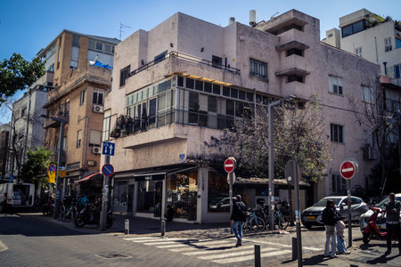 Tel Aviv, Israel, February 26 2026, Sheinkin Street View, immersive urban perspective, legendary Bauhaus lines, rhythmic shadow patterns on white facades, vibrant city atmosphere, structural elegance and cascading light observed by I.C.R.U.のeditorial素材