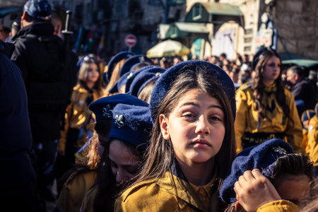 Bethlehem, West Bank, December 24, 2025 Close-up of a young Palestinian scout during the annual Christmas parade. Intense gaze testifies to the strength of character of the local youth celebrating.のeditorial素材
