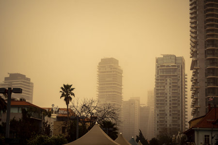 Tel Aviv, Israel, March 14, 2026 A thick layer of desert sand and dust blankets the streets during a...