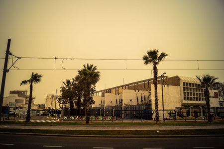 Tel Aviv, Israel, March 14, 2026 A thick layer of desert sand and dust blankets the streets during a Sharav atmospheric phenomenon, creating a surreal orange glow and reducing visibility across the metropolitan area.のeditorial素材
