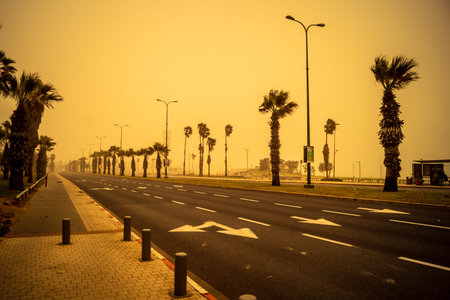Tel Aviv, Israel, March 14, 2026 A thick layer of desert sand and dust blankets the streets during a...